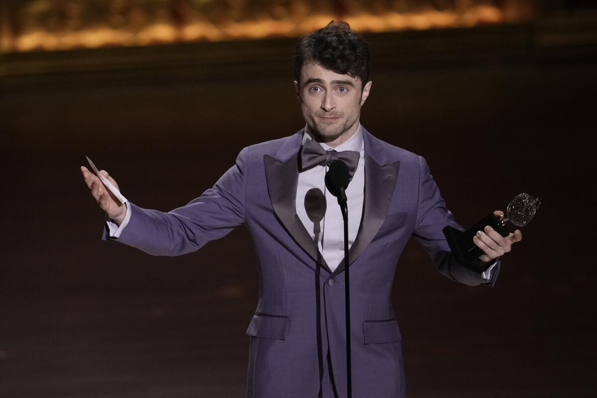 Daniel Radcliffe accepts the Tony Award for best actor in a featured role in a musical for "Merrily We Roll Along."