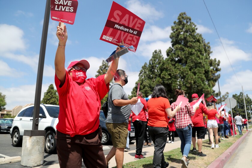 Nurses rally for more personal protective equipment and a safer workload of patients.
