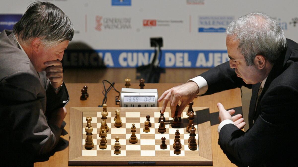 Former chess world champions Garry Kasparov, right, and Anatoly Karpov play an exhibition rematch in Valencia, Spain, on Sept. 22, 2009.