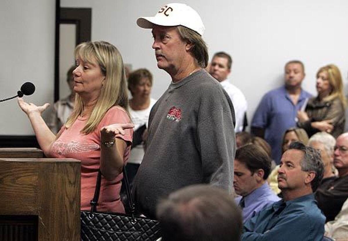 Diane and Doug Manista speak at Tuesday's Yorba Linda City Council meeting, angry about a hydrant near their house that wasn't functioning as the fire raged. Their home was destroyed.