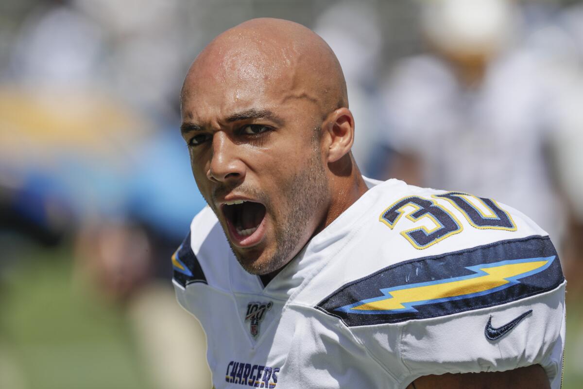 Chargers running back Austin Ekeler yells  to teammates during warmups last season.