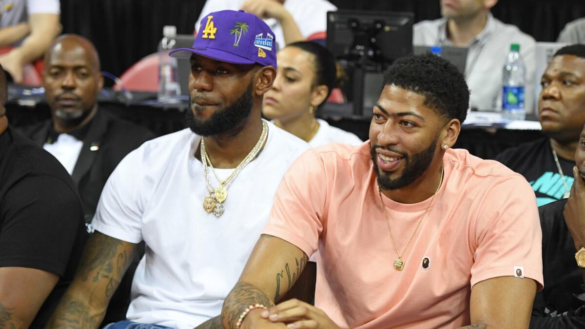 LeBron James and soon-to-be Lakers teammate Anthony Davis watch a Las Vegas Summer League game between the New Orleans Pelicans and the New York Knicks on Friday night.