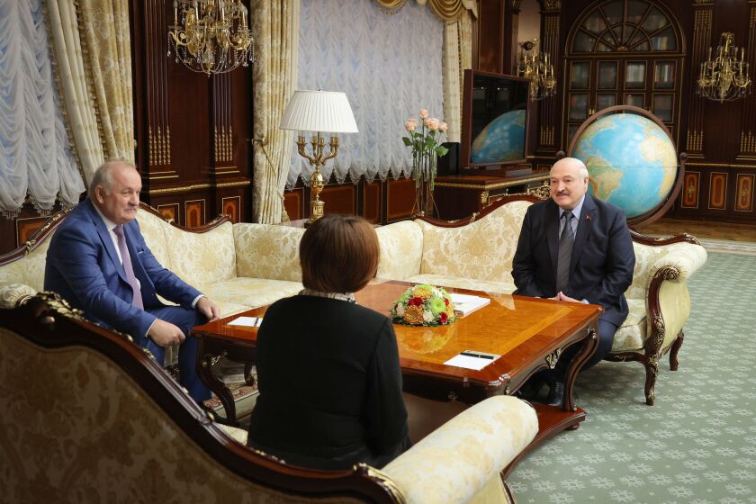 In this handout photo released by Belarusian Presidential Press Office, Belarusian President Alexander Lukashenko, right, speaks with the head of Russia's Central Bank Elvira Nabiullina, centre, in Minsk, Belarus, Monday, May 29, 2023. At left is Pavel Kallaur, chairman of the National Bank of the Republic of Belarus. (Belarusian Presidential Press Office via AP)