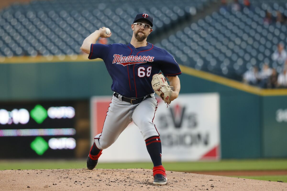 Minnesota Twins pitcher Randy Dobnak throws against the Detroit Tigers in the first inning of a baseball game in Detroit, Wednesday, Sept. 25, 2019. (AP Photo/Paul Sancya)