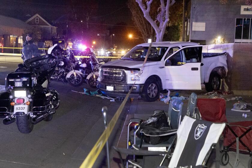 A Ford F-150 that was backing up hit three people Thursday night before the Bakersfield Christmas Parade began.