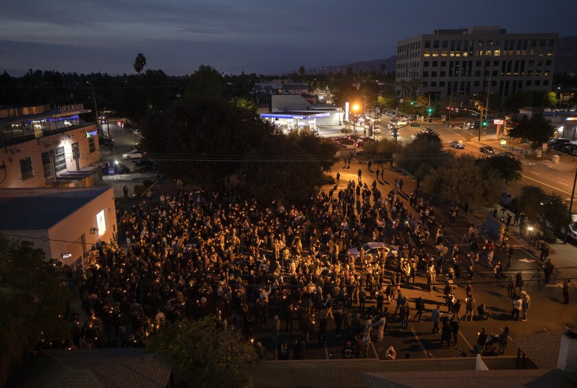 A candlelight vigil for cinematographer Halyna Hutchins is held in Burbank on Sunday.