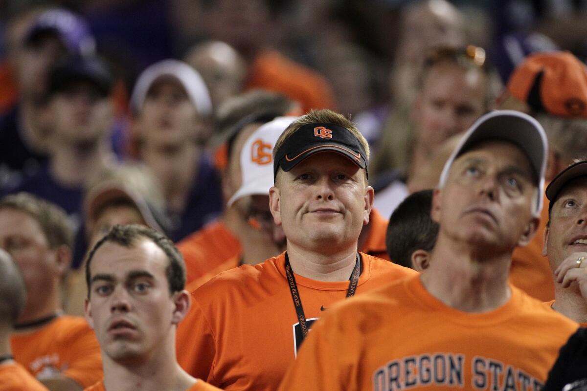 Dejected Oregon State fans during an NCAA college football game against TCU.