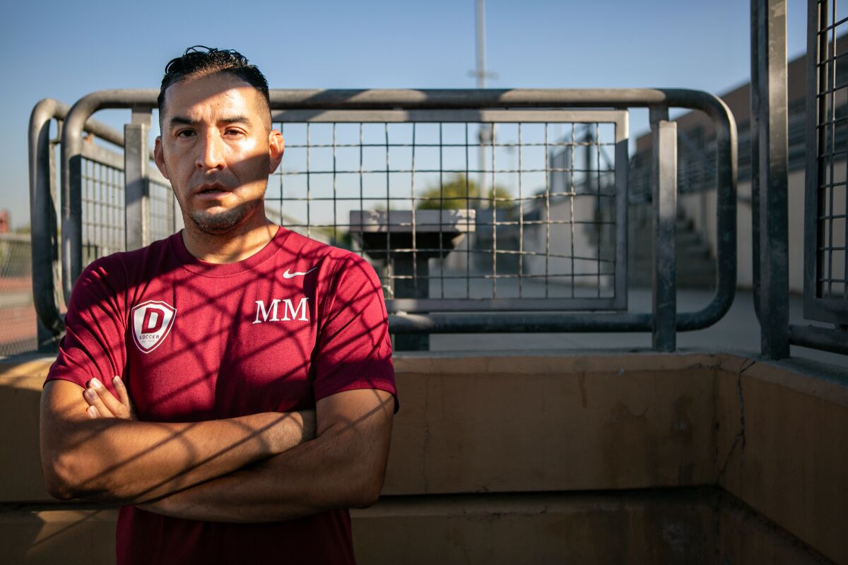 Downey High soccer coach Marvin Mires poses for a portrait during the coronavirus pandemic in 2020.