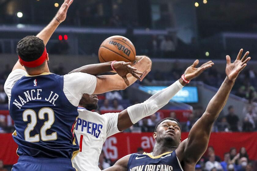 Los Angeles, CA, Sunday, October 30, 2022 - LA Clippers guard Reggie Jackson (1) is stripped of the ball by New Orleans Pelicans forward Larry Nance Jr. (22) in the first half at Crypto.com Arena. (Robert Gauthier/Los Angeles Times)