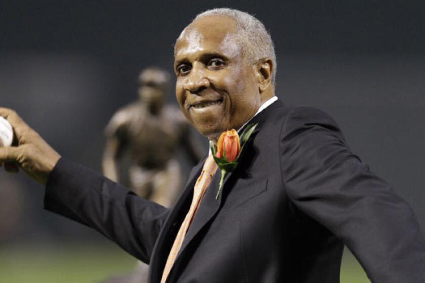 Former Orioles outfielder Frank Robinson throws out the ceremonial first pitch before a game in Baltimore in April 2012.