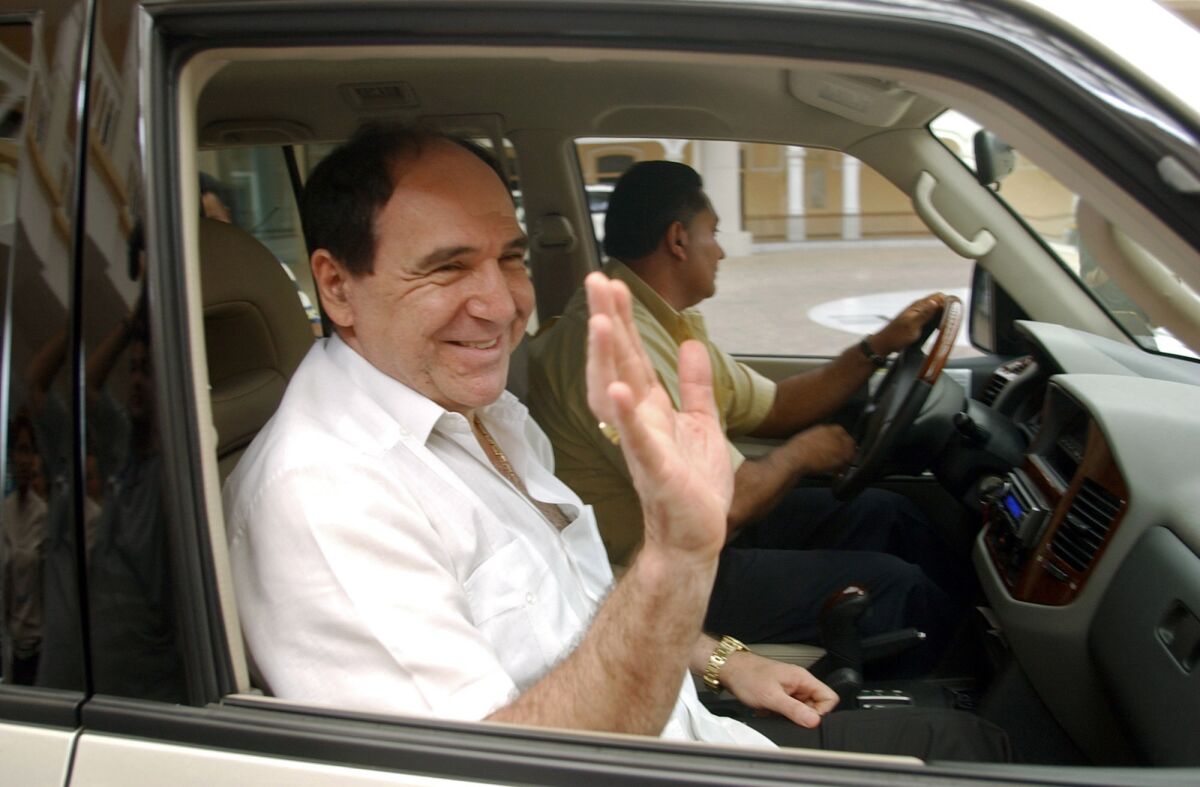 FILE - In this April 27, 2005 file photo, Ecuador's former President Abdala Bucaram leaves the Foreign Ministery in Panama City, where he sought political asylum after fleeing his country amid massive protests that forced the ouster of President Lucio Gutierrez. Bucaram was detained at his home in Guayaquil, Ecuador on June 3, 2020, during a search warrant ordered by the Prosecutor's Office investigating alleged embezzlement through a contract for hospital medical supplies. (AP Photo/Arnulfo Franco, File)