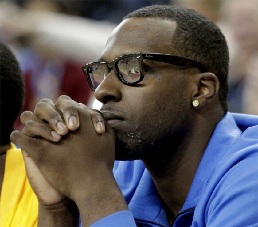 Bruins' top recruit Shabazz Muhammad watches the game against Indiana State from UCLA's bench.