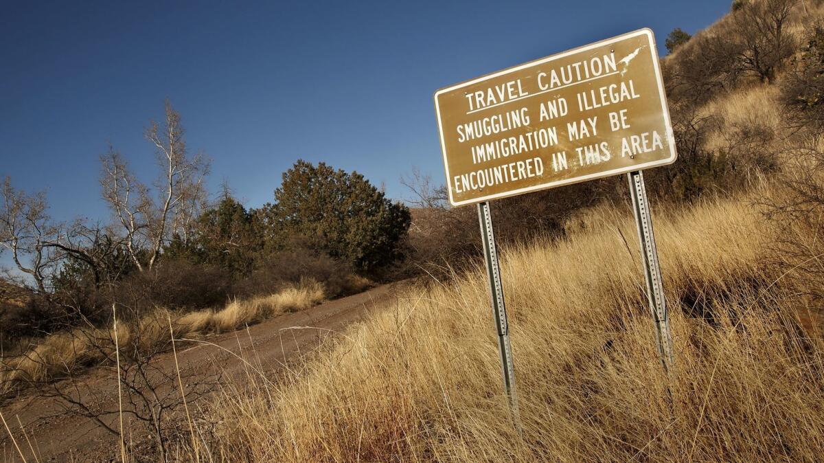 Forty miles east of Douglas, Ariz., not far from the property of rancher Sue Krentz, a warning sign.