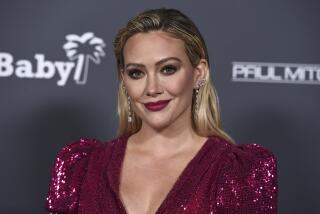 Hilary Duff arrives at the Baby2Baby Gala at the Pacific Design Center on Saturday, Nov. 13, 2021, in West Hollywood, Calif. (Photo by Jordan Strauss/Invision/AP)