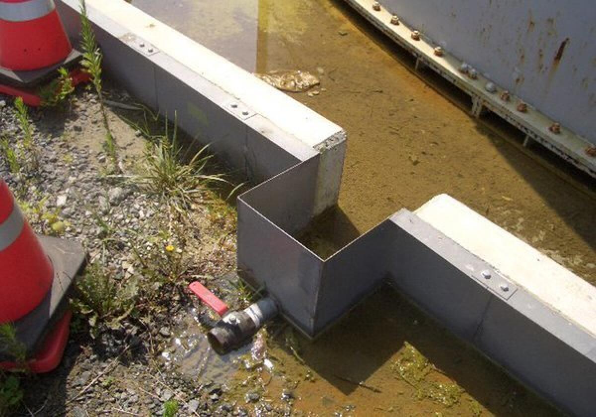 Contaminated water stands on the ground after leaking from the Fukushima Daichi nuclear power plant.