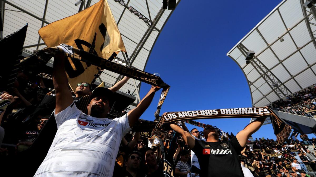 LAFC fans cheer during a game with the Seattle Sounders on April 21 at Banc of California Stadium.