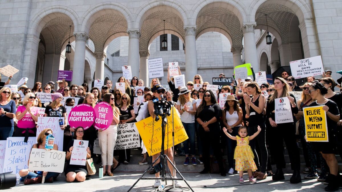 Activists participate in the "Believe Survivors. Stop Kavanaugh" rally hosted by Time's Up and other groups at Los Angeles City Hall in September.