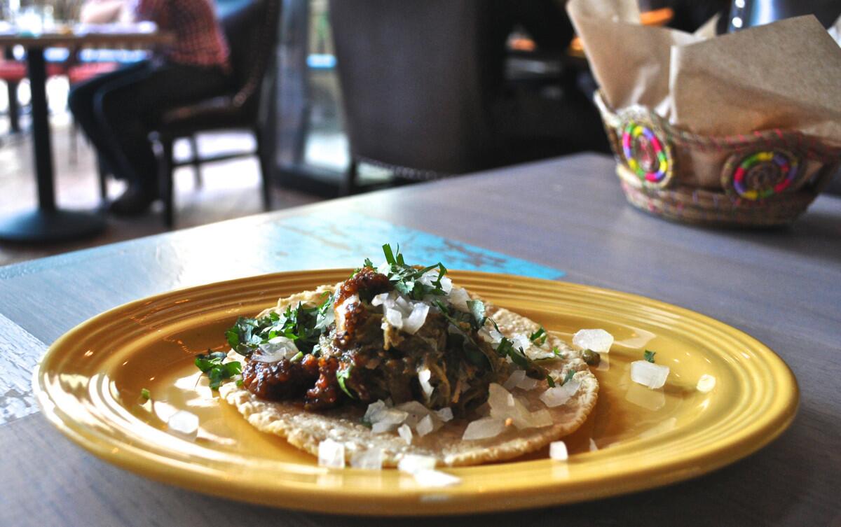 A chile verde carnitas taco is among the many tacos offered at Pez Cantina.