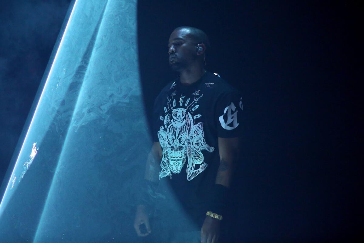 Kanye West, seen performing in March at a promotional event for Samsung in Austin, Texas, plans to release a new album by the end of 2014.