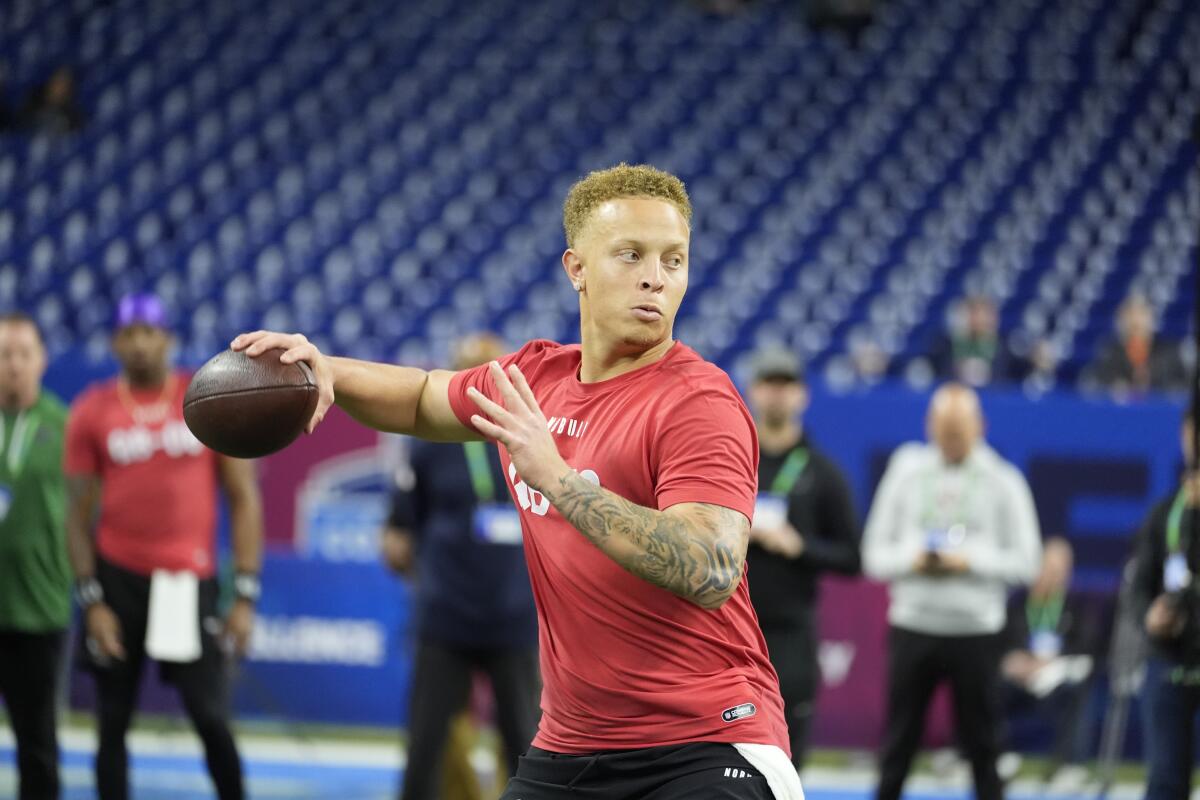 South Carolina quarterback Spencer Rattler throws during a drill at the scouting combine in March.