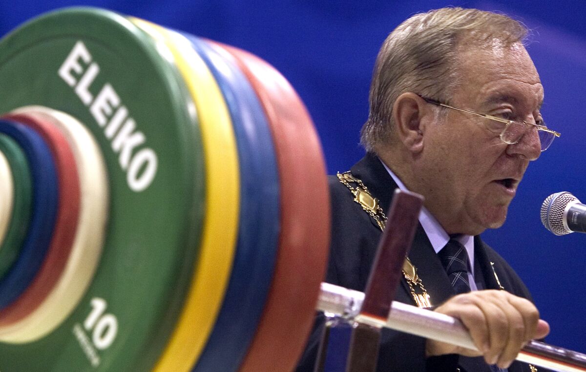 FILE - President of the International Weightlifting Federation Tamas Ajan speaks during the opening ceremony of the 2006 World Weightlifting Championships in Santo Domingo, Dominican Republic, Friday, Sept. 29, 2006. The former IOC member who ran weightlifting’s governing body for more than 40 years has banned for life for corrupting the sport’s anti-doping program. The Court of Arbitration for Sport found Tamss Ajan guilty of tampering and hiding doping cases. (AP Photo/Ramon Espinosa, File)