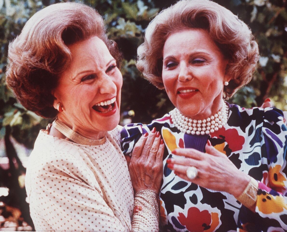 "Dear Abby" writer Pauline Friedman Phillips, left, and her twin sister, Eppie Lederer -- known professionally as Ann Landers -- attend their 50th high school reunion in Sioux City, Iowa.