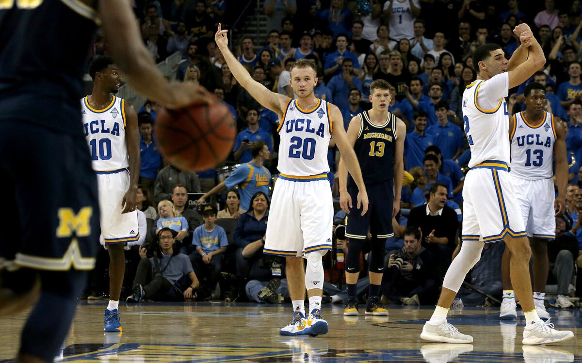 UCLA guard Bryce Alford (20) and his Bruins teammates celebrate after an Alford basket late in the second half of a game against Michigan on Dec. 10.