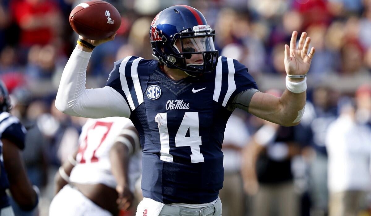 Mississippi quarterback Bo Wallace passed for three touchdowns against Alabama, including two in the fourth quarter.