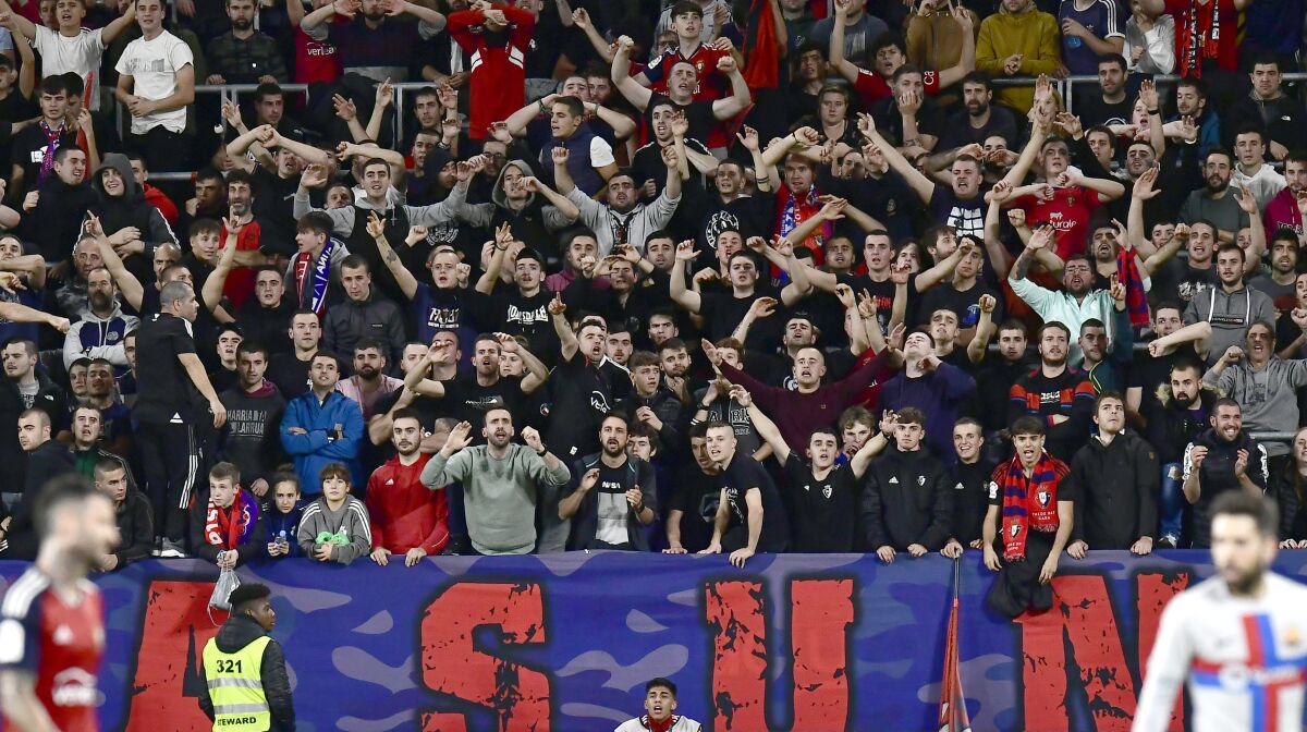 Osasuna fans cheer during a La Liga soccer match against Barcelona 