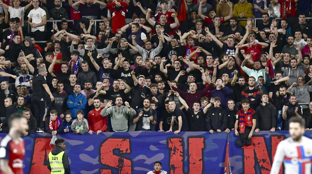 Osasuna fans cheer during a La Liga soccer match against Barcelona