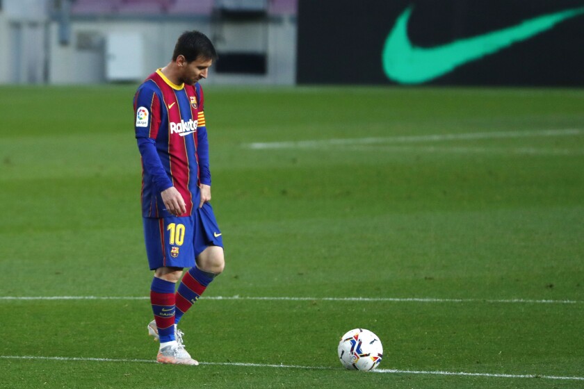 FILE - In this file photo dated Thursday, April 29, 2021, Barcelona's Lionel Messi reacts during the Spanish La Liga match against Granada at the Camp Nou stadium in Barcelona, Spain. Lionel Messi and Barcelona are closer to signing a new deal that would keep the Argentina soccer star at the Spanish club through the end of his playing career, according to an unidentified insider Friday July 16, 2021. (AP Photo/Joan Monfort, FILE)