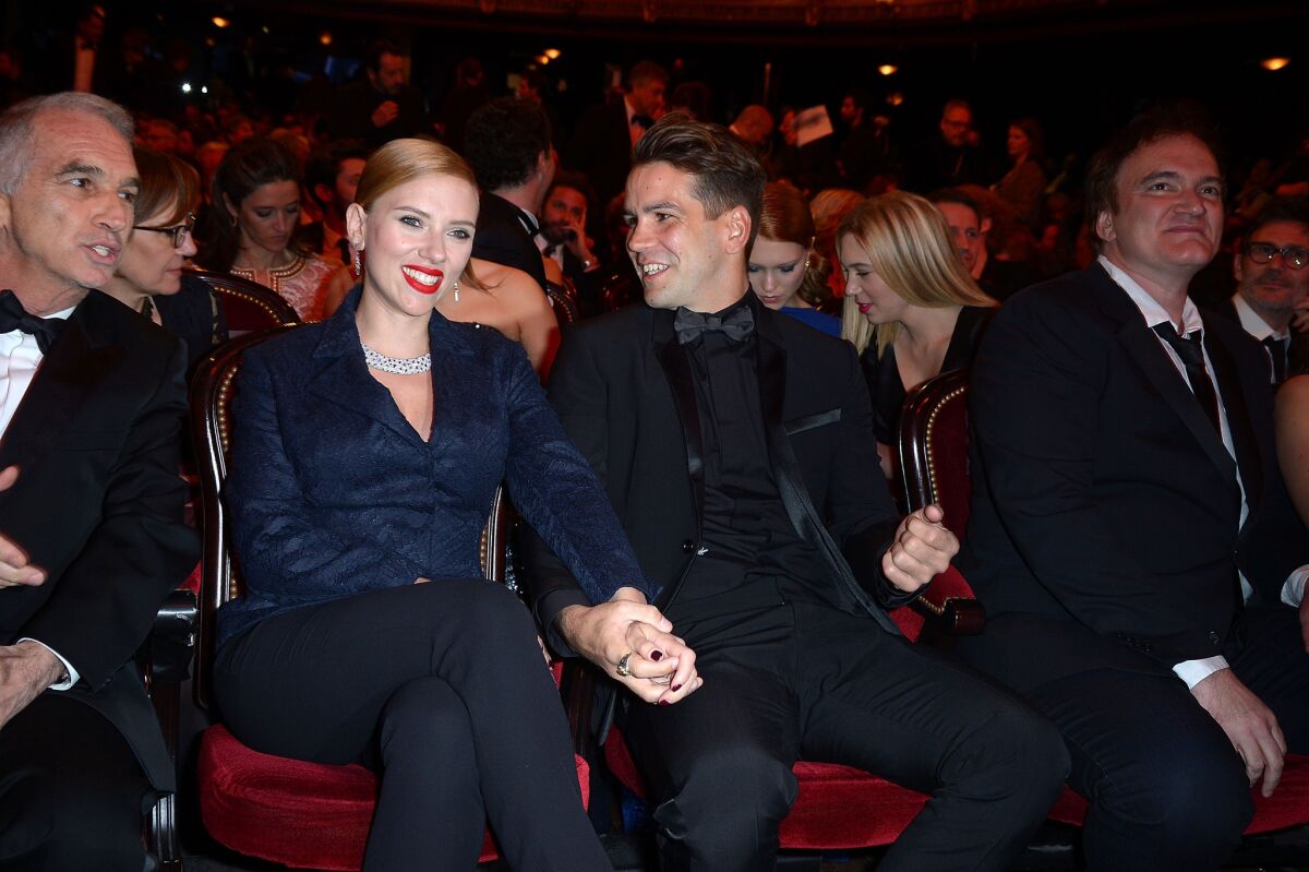 Actress Scarlett Johansson reportedly weds Romain Dauriac in secret.