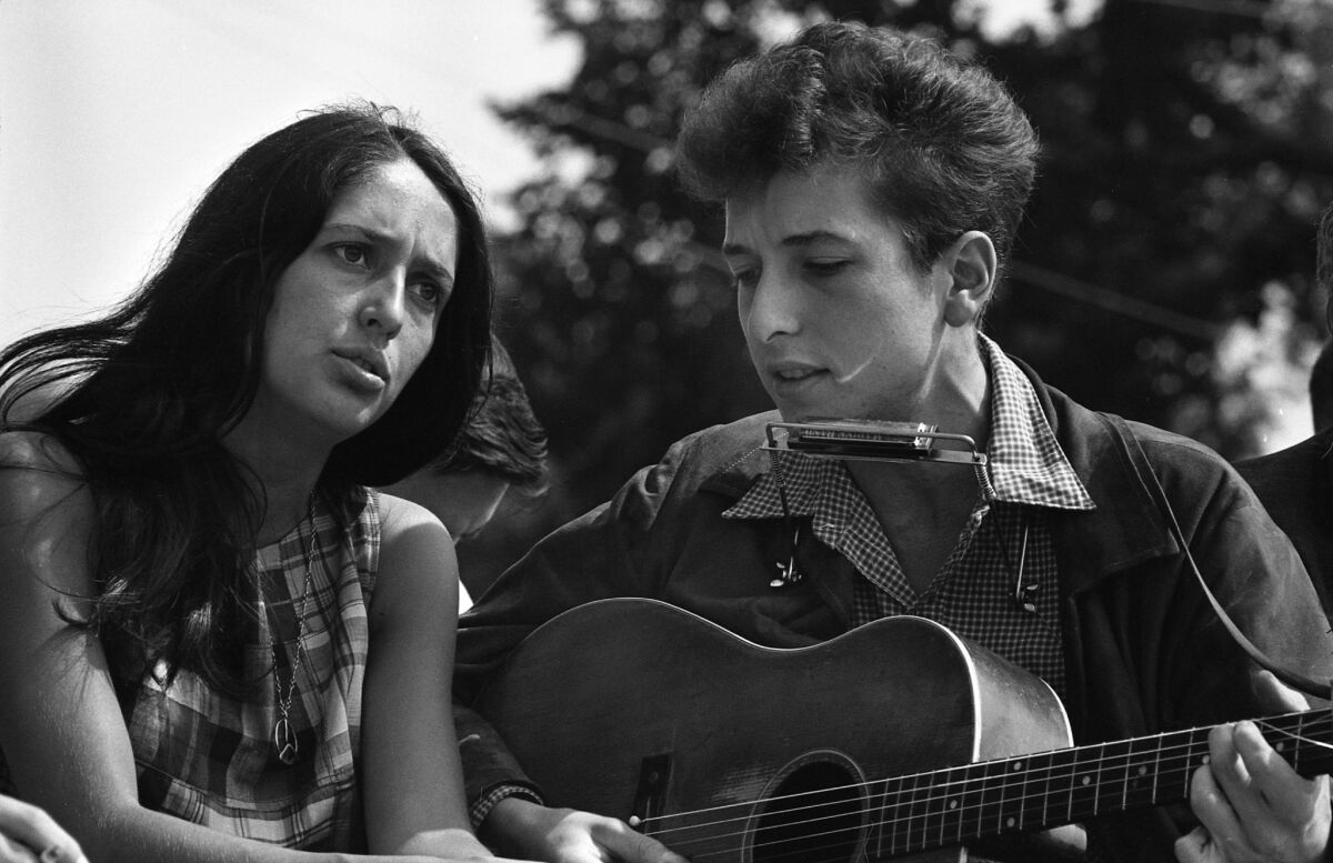Folk singers Joan Baez and Bob Dylan performing in Washington, D.C., during the March on Washington civil rights rally on Aug. 28, 1963.