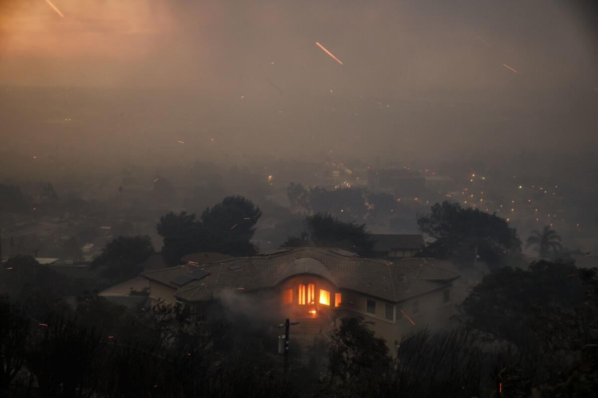 A home burns on a hillside overlooking Ventura.