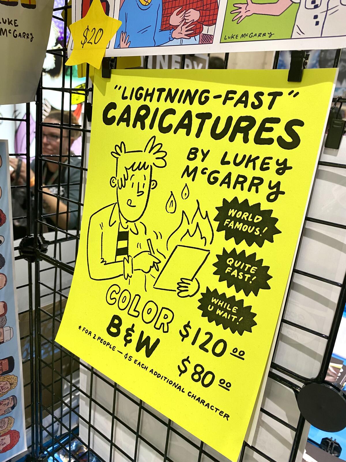A sign for "Lightning-Fast" Caricatures by Luke McGarry at the cartoonist's booth at Comic-Con.
