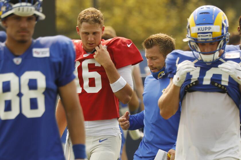 THOUSAND OAKS, CA - AUGUST 18: Los Angeles Rams head coach Sean McVay talks with quarterback.