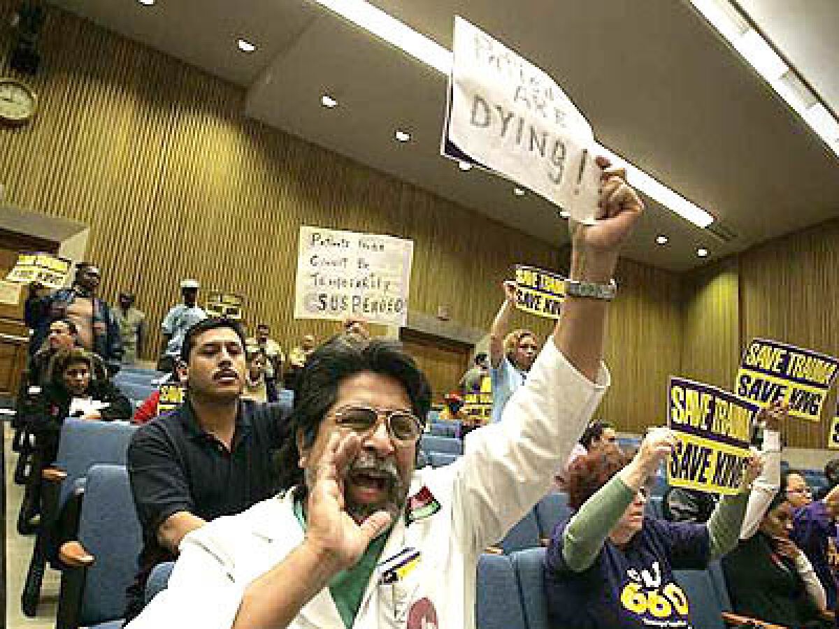 Fred Huicochea, a nurse at King/Drew Medical Center, jeers with others in the crowd at the county Hall of Administration as supervisors sealed the trauma centers fate.