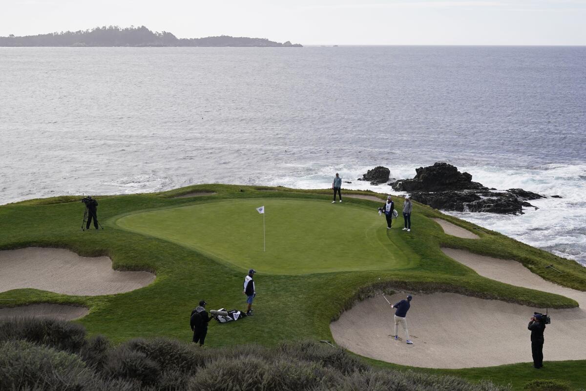Henrik Norlander plays out of a bunker onto the seventh green during Sunday's final round at Pebble Beach Golf Links.