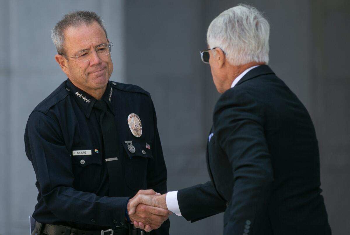 LAPD Chief Michel Moore and L.A. County Dist. Atty. George Gascón