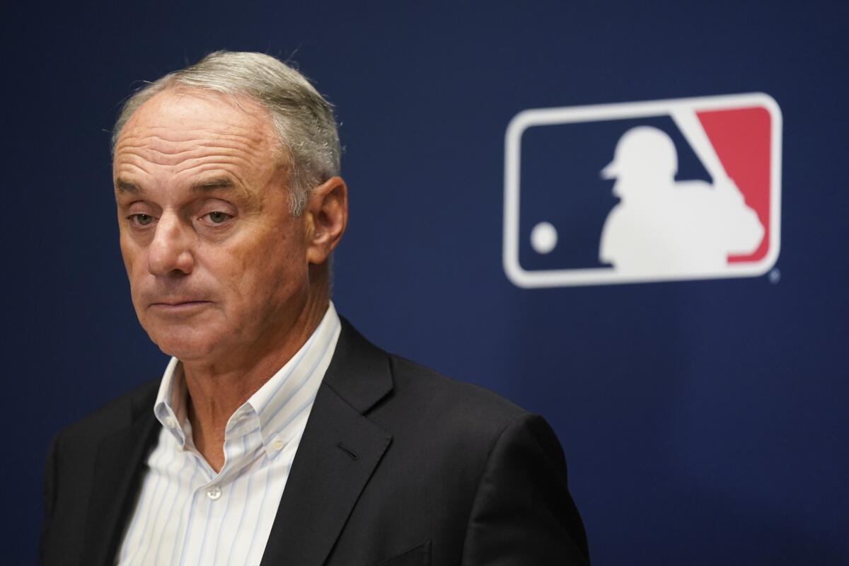 Major League Baseball Commissioner Rob Manfred speaks to reporters after an owners' meeting in New York.