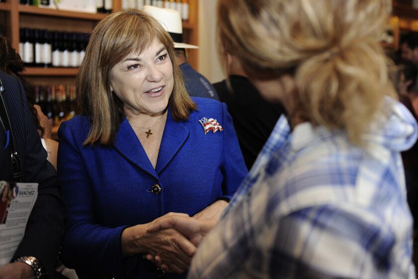 U.S. Senate candidate Loretta Sanchez talks with potential voters at San Antonio Winery on Sunday.