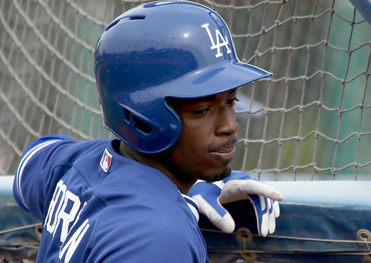 Dodgers infielder Dee Gordon, who had two stolen bases and scored a run Saturday, waits to take batting practice last week at Camelback Ranch.