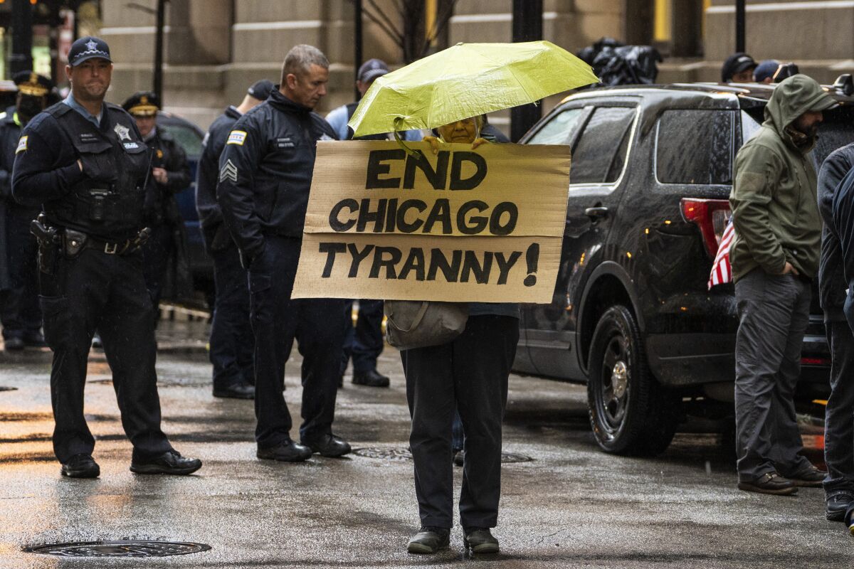 Fraternal Order of Police Lodge 7 members and their supporters protest against COVID-19 vaccine mandates outside City Hall before a Chicago City Council meeting, Monday, Oct. 25, 2021. (Ashlee Rezin/Chicago Sun-Times via AP)