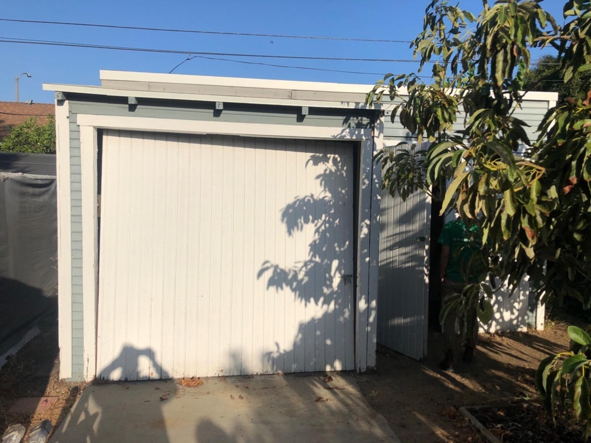 A single-car garage with a white garage door.