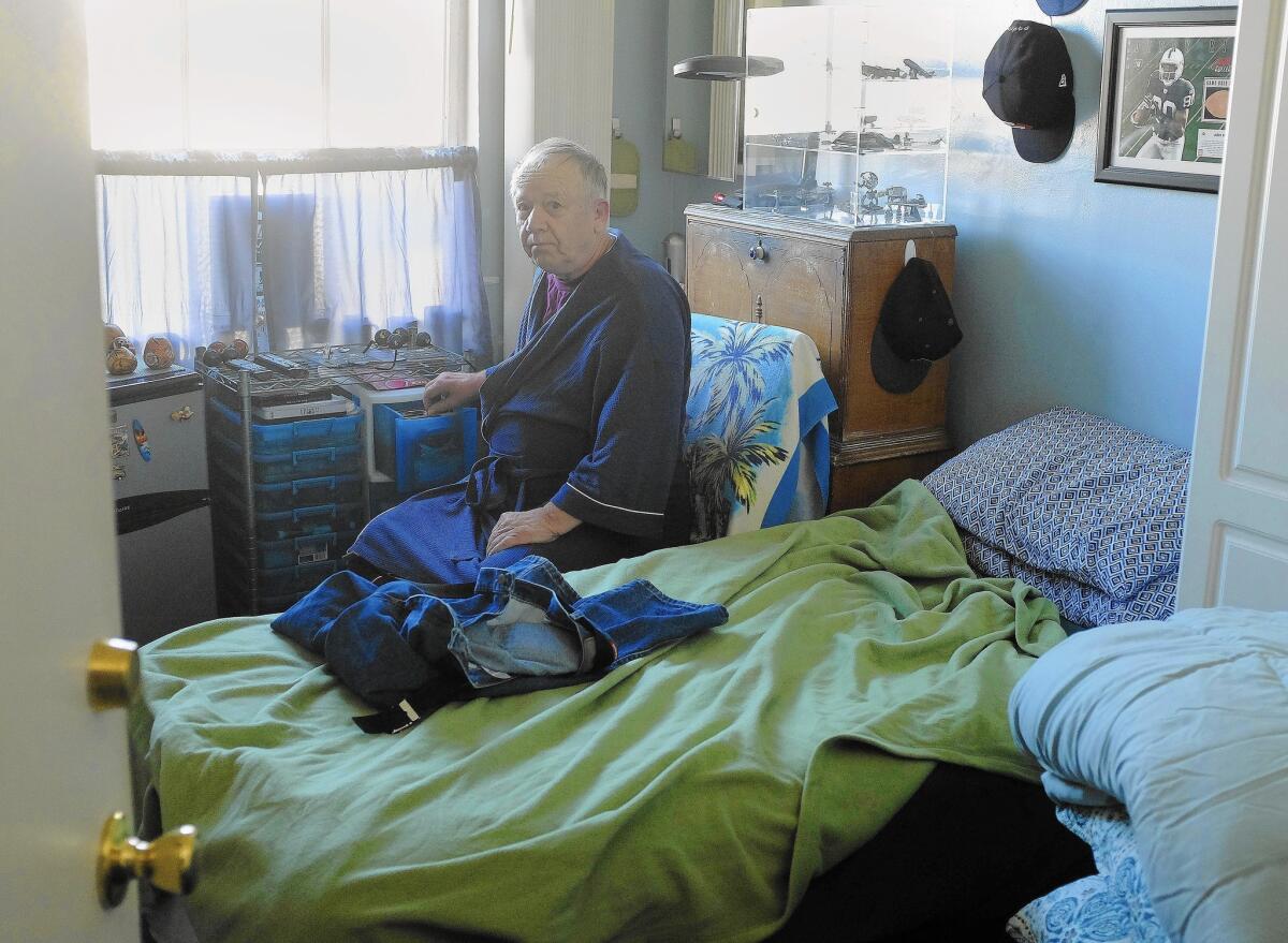 Gene Huncovsky has lived in his single-room-occupancy hotel in downtown San Diego for nine years. "I love it," he says.