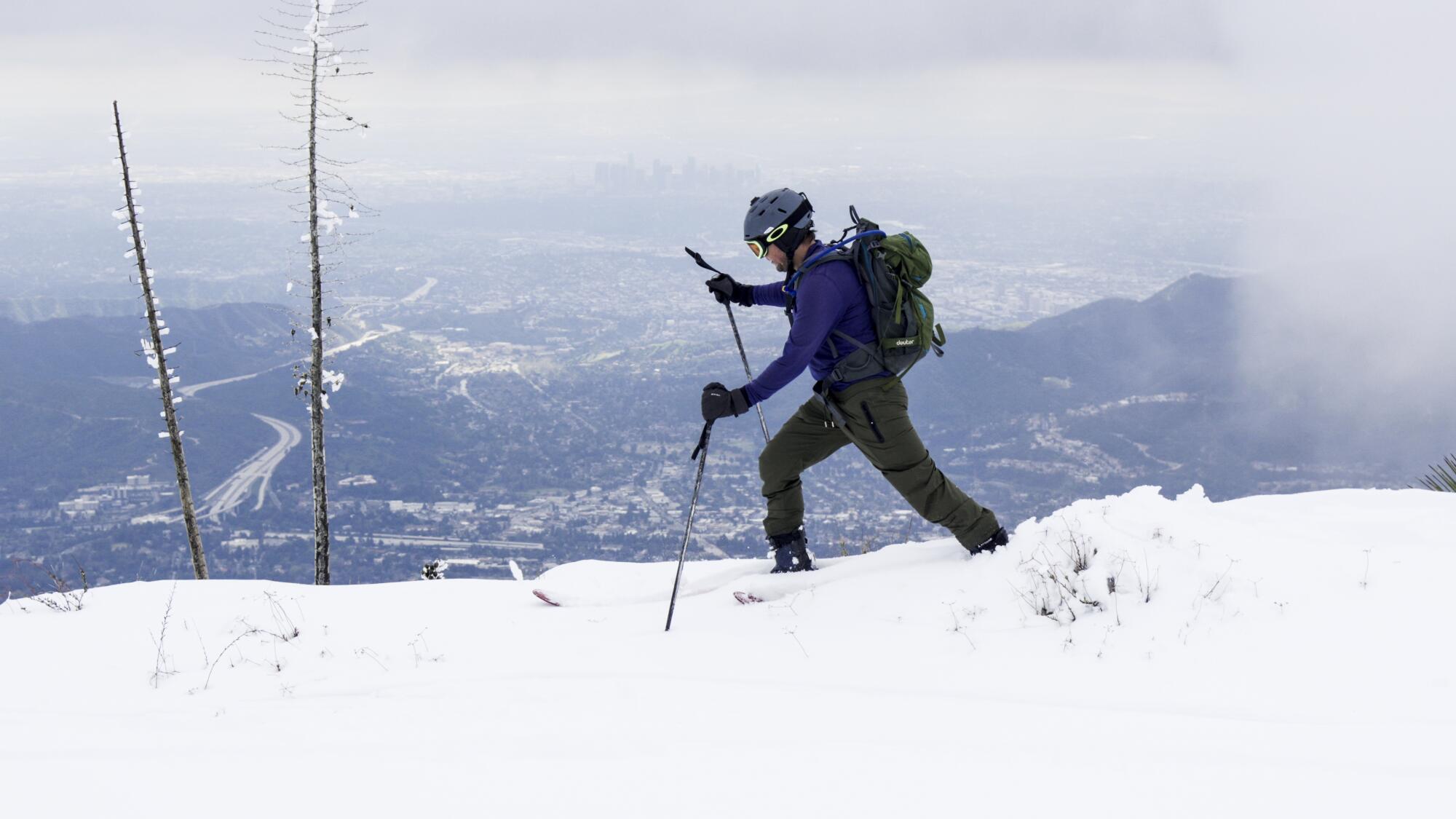 Matt Dixon skis along the east ridge of Mt. Lukens with the downtown Los Angeles skyline in the distance.