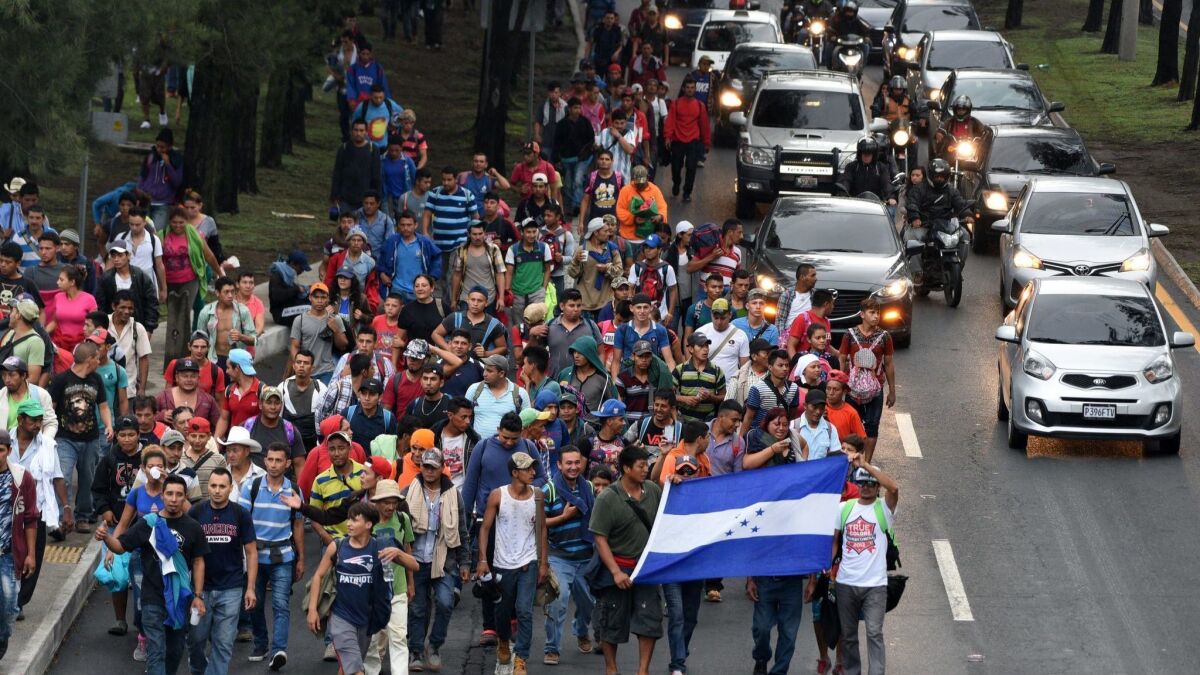 Honduran migrants head toward the Mexico border en route to the United States.
