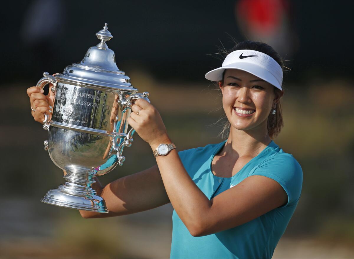 Michelle Wie poses with the trophy Sunday after winning the U.S. Women's Open in Pinehurst, N.C.