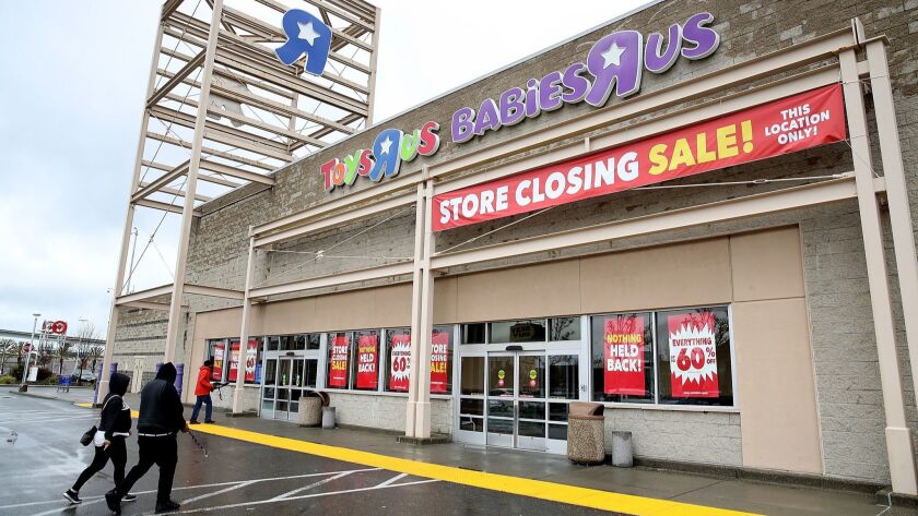 Customers enter a Toys R Us store in Emeryville, Calif. Toys R Us filed for liquidation and plans to close its 735 stores.