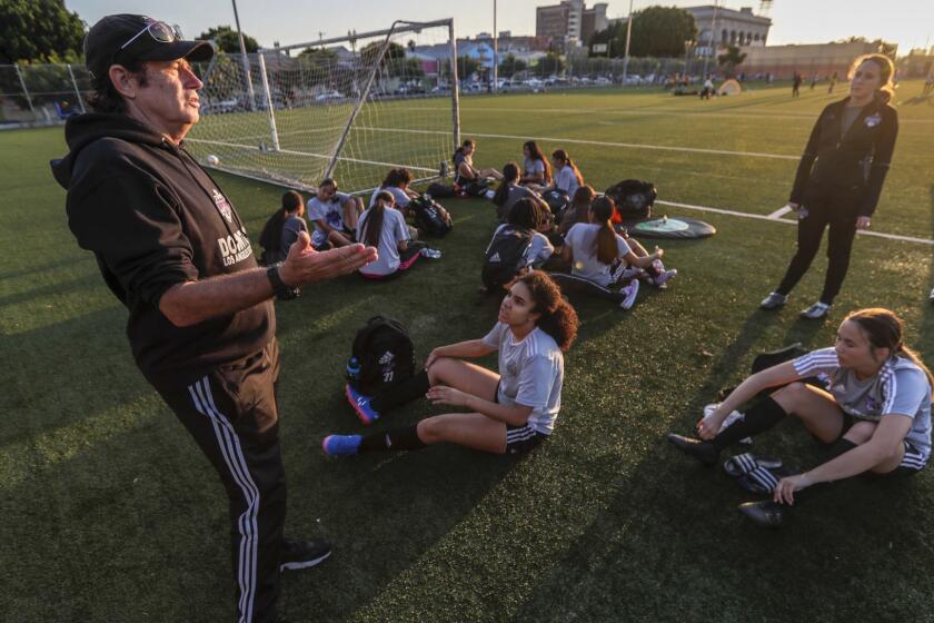 LOS ANGELES, CA, WEDNESDAY, JUNE 26, 2019 - Downtown Los Angeles Soccer Club coach Mick Muhlfriedel talks with his players during practice at Liechty Middle School. His mission is to empower young Latino women through soccer, helping them break the cultural barriers that often keep them from realizing their athletic dreams. (Robert Gauthier/Los Angeles Times)